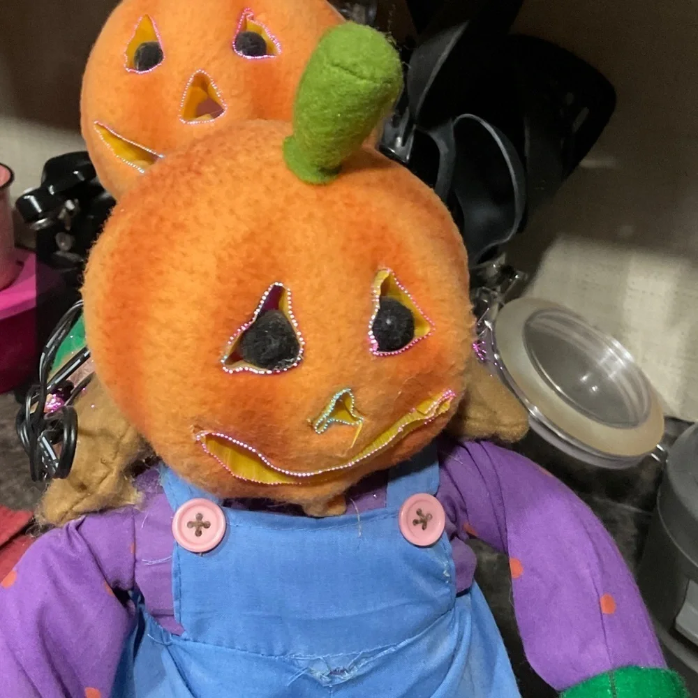 Festive Pumpkin Head Decor with Blue Overalls